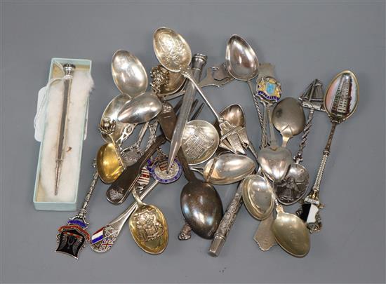 A collection of silver and plated souvenir spoons, a silver pencil holder and propelling pencil and sundries